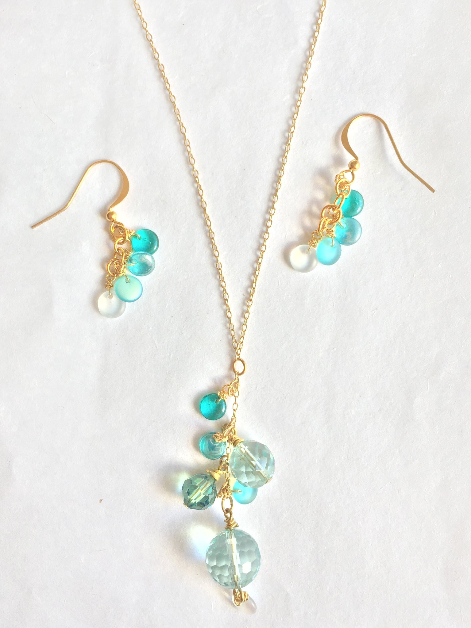 blue glass and gold necklace and earrings