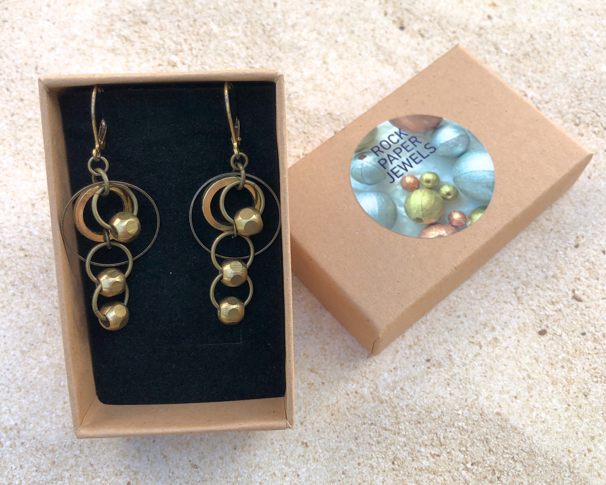 brass dangle earrings with smooth brass beads in rock paper jewels gift box