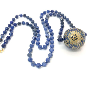 close up of knotted sodalite bead necklace with handmade bead charm