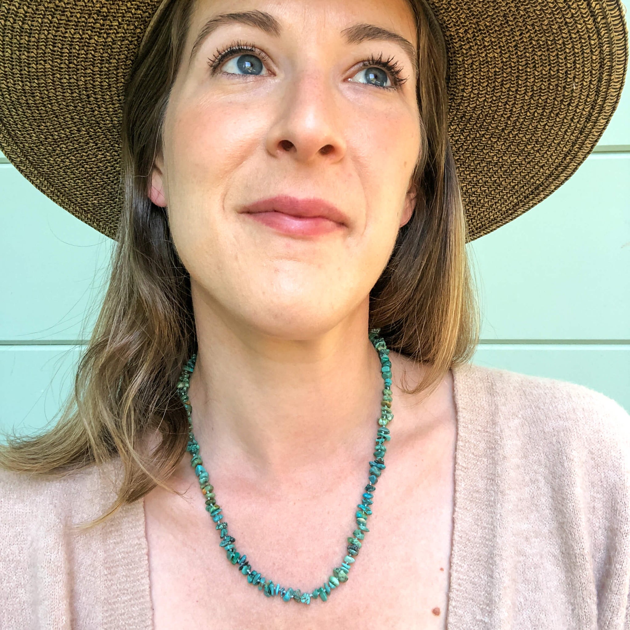 hand knotted turquoise nugget necklace shown on model