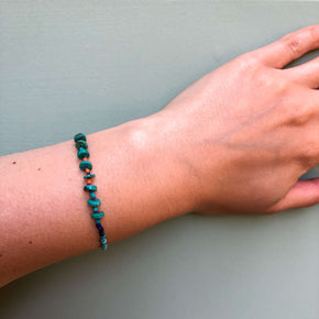 Hand knotted turquoise, lapis and howlite heishi beaded bracelet modeled on wrist