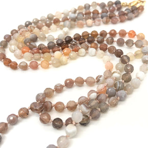 closeup of knotted two strand ombre agate beaded necklace