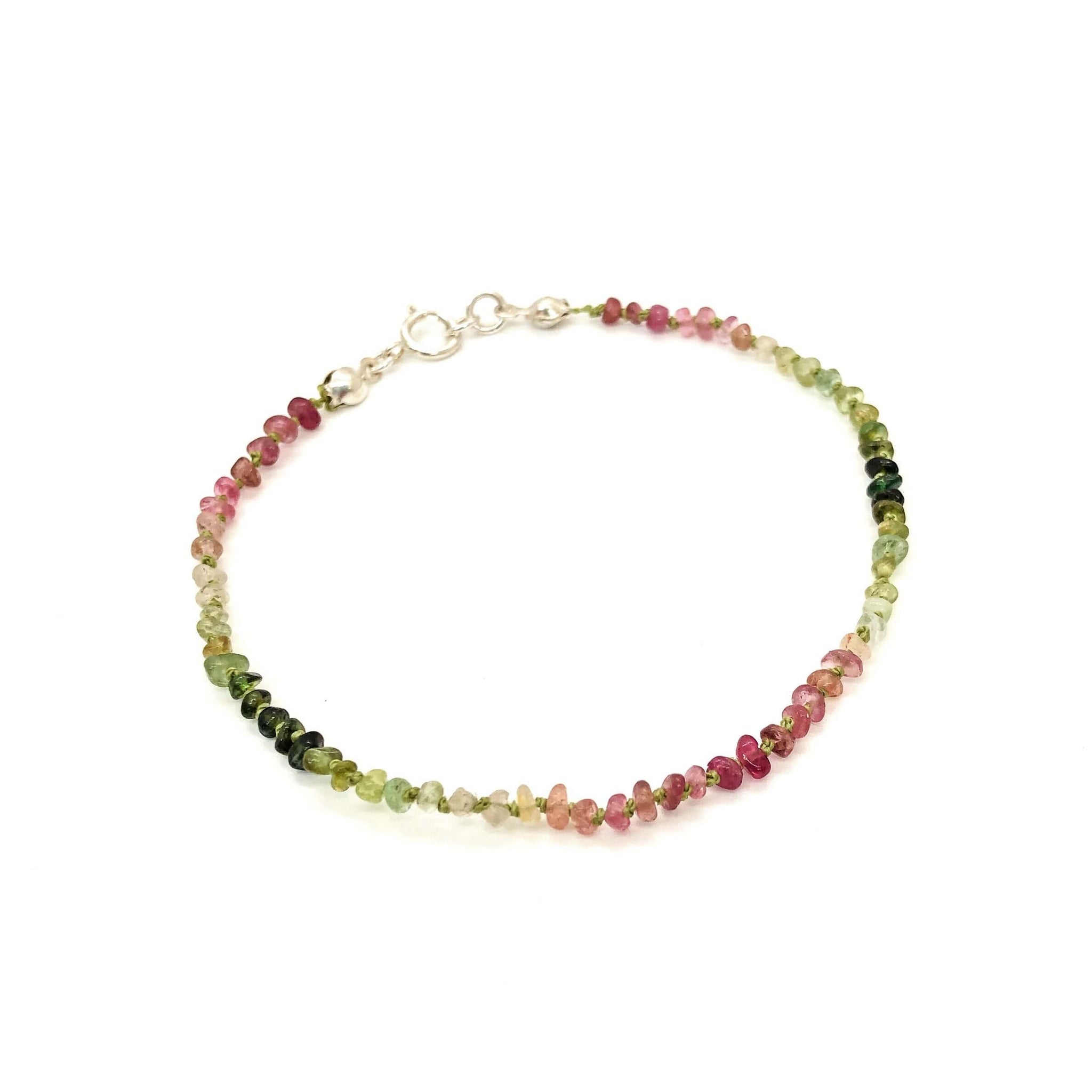 Hand knotted pink and green ombre tourmaline nugget bracelet shown on white background